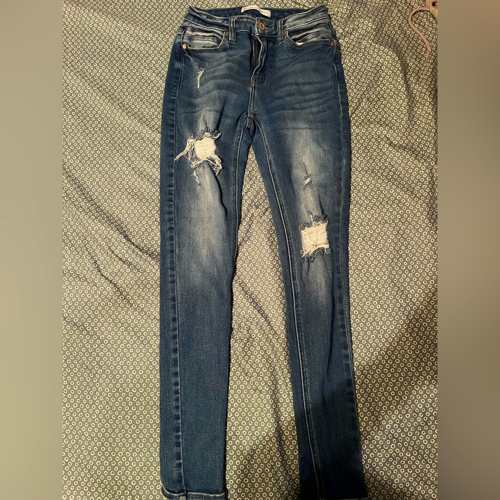 ripped blue skinny jeans